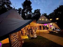 Wedding guests inside the tipi at Cannon Hall. 