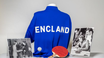 A photo of Alan Hydes alongside his blue England shirt, and a bat and ball