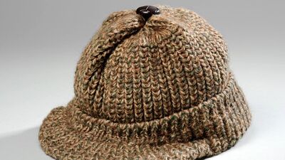 a brown pleated hat