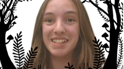 Smiling young person with long hair framed by a circular border of stylized black branches and ferns. A purple label at the bottom reads "Maisie Boyd.