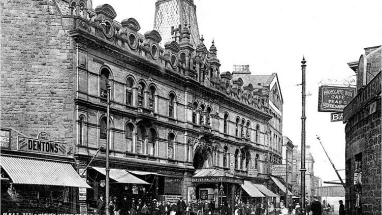 A postcard of Eldon Street in the early 20th century with the Civic building in the foreground. There are CGI added snowflakes
