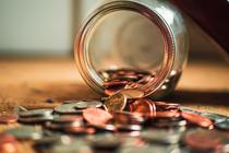 Jar of coins that has been spilled