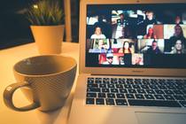 Desk with laptop and cup of coffee