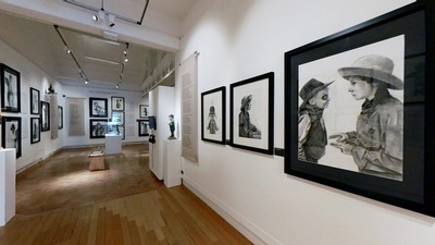 A view of the exhibiton space with several of Graham's charcoal drawings in view