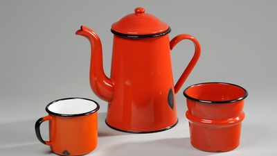 Orange tea set with tea cup, teapot and strainer